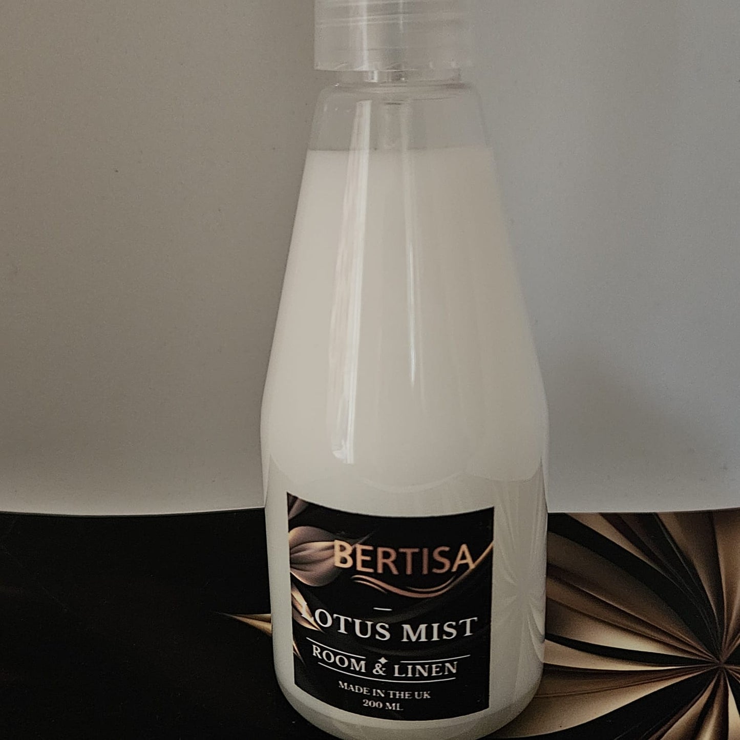 Bottle of Bertisa Lotus Mist Room & Linen spray on a neutral background
