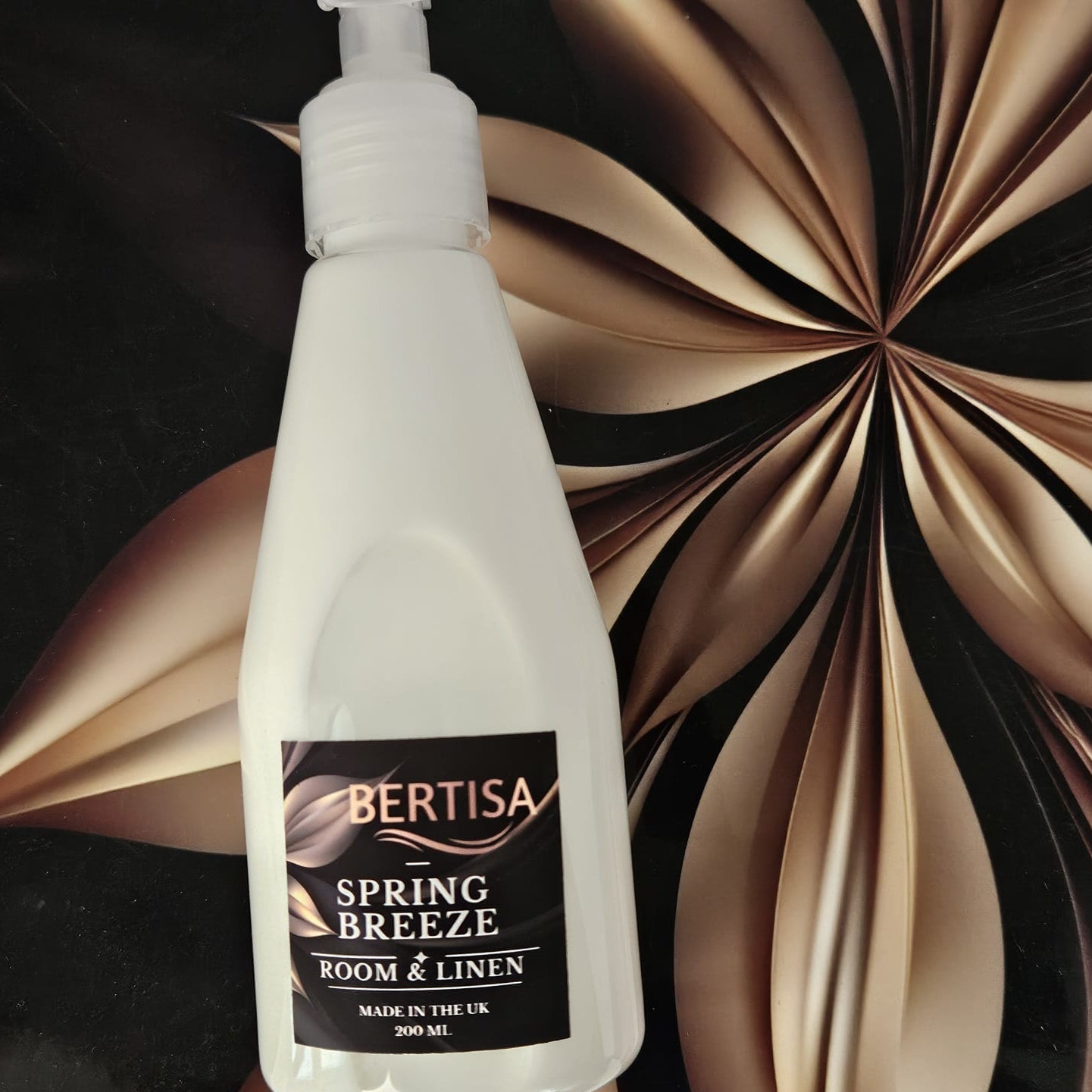 White bottle of Bertisa Spring Breeze room and linen spray against a decorative background
