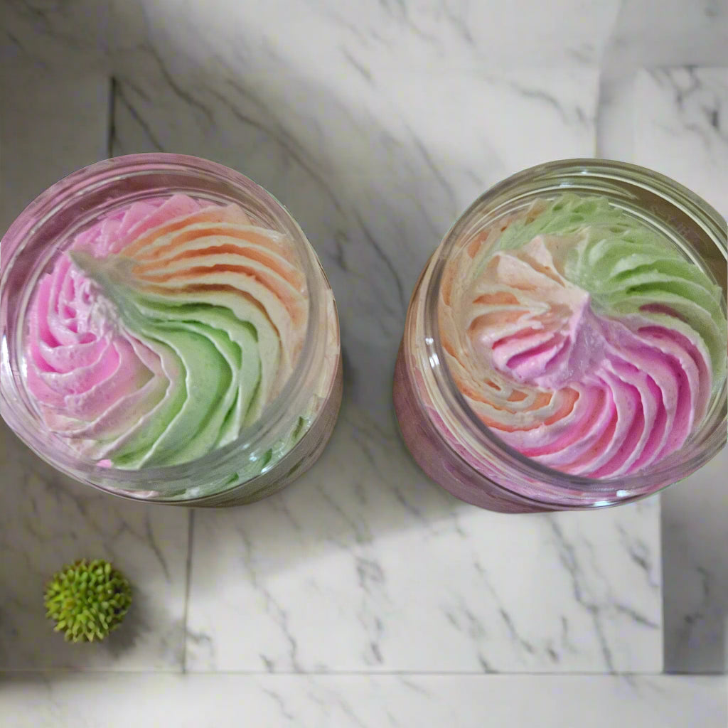 Two containers of colorful swirled candy on a wooden surface