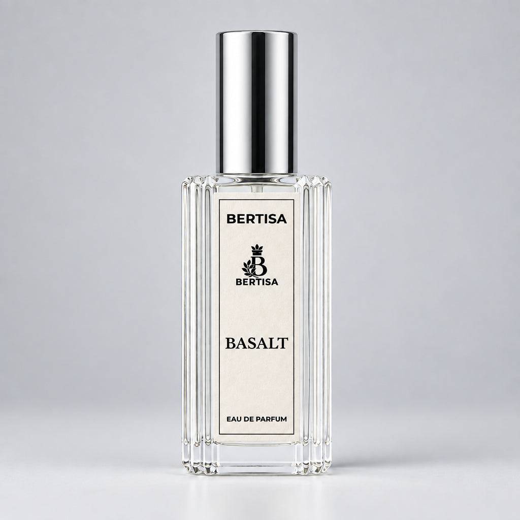 Clear eau de parfum bottle with silver cap and BERTISA BASALT label