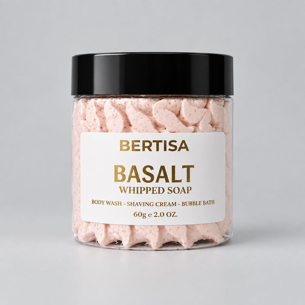 Pink whipped body soap in clear jar with black lid and gold label