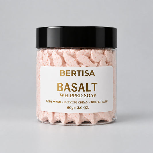 Pink whipped body soap in clear jar with black lid and gold label