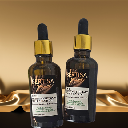 Two bottles of Bertisa 2-in-1 Thinning Therapy Scalp & Hair Oil on a gold background