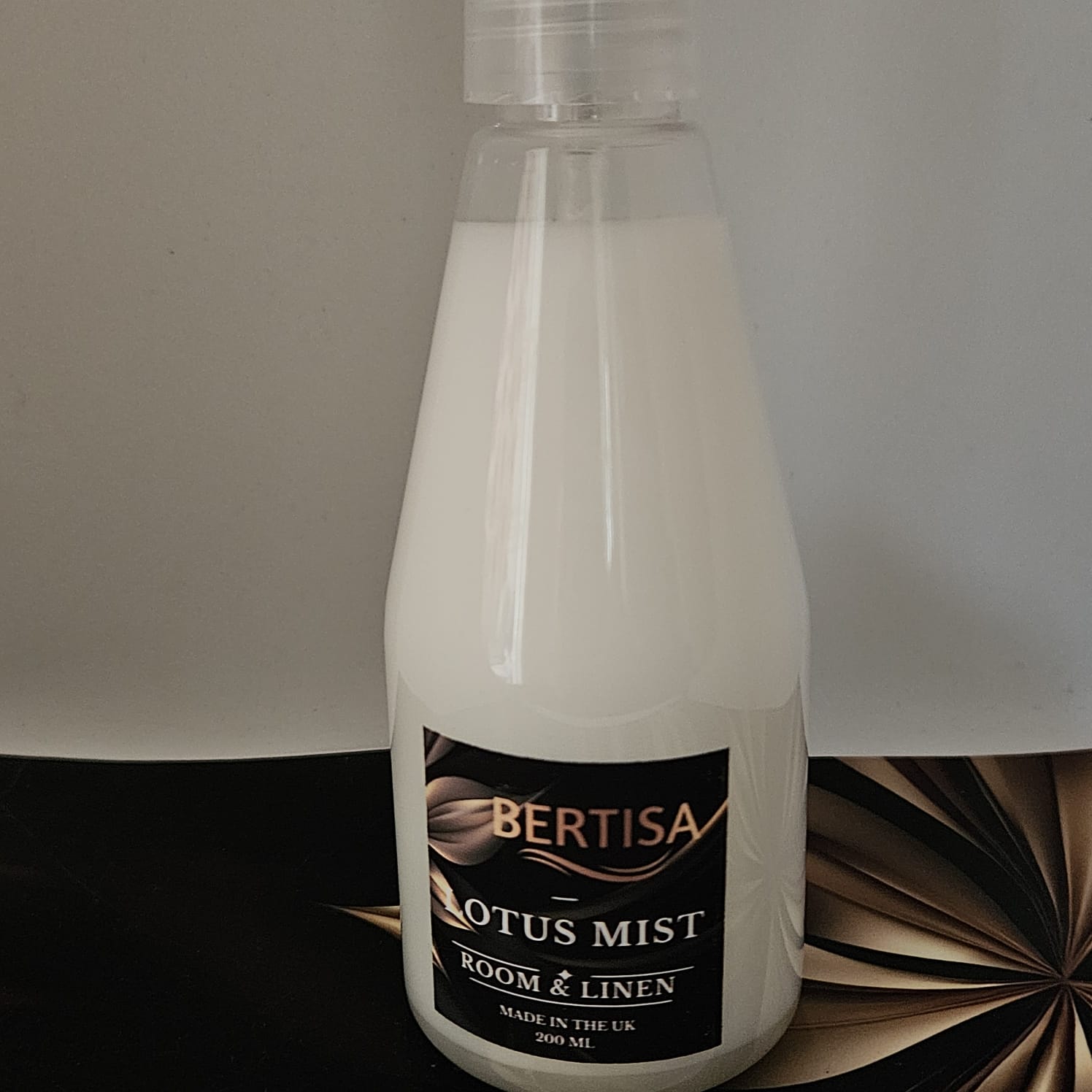 Bottle of Bertisa Lotus Mist Room & Linen spray on a neutral background