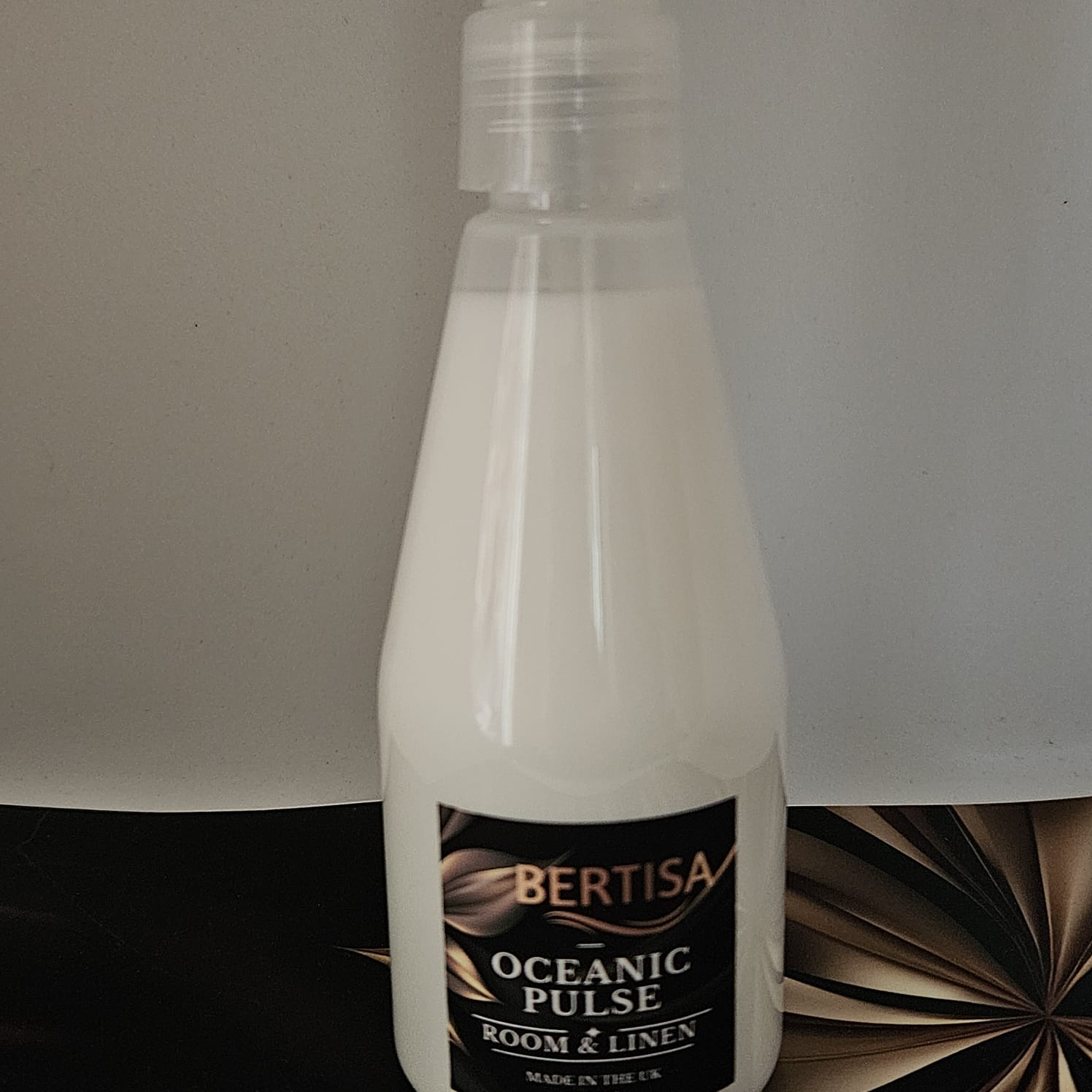 Bottle of Bertisa Oceanic Pulse room & linen spray on a neutral background