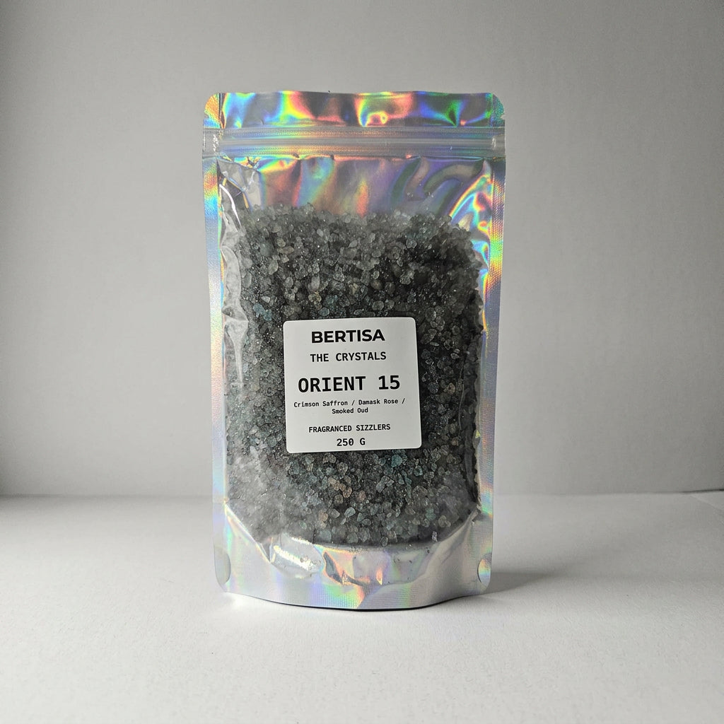 Holographic resealable pouch of Orient 15 fragranced sizzlers, 250g, with black and blue crystals