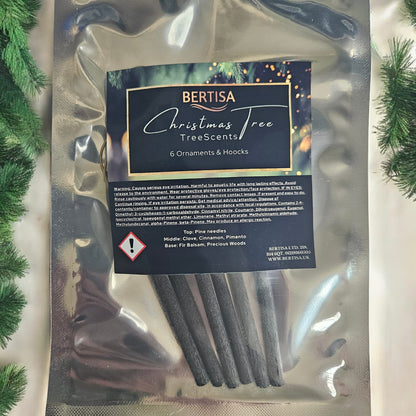 Packaged Christmas tree scents with Bertisa branding on a decorative background