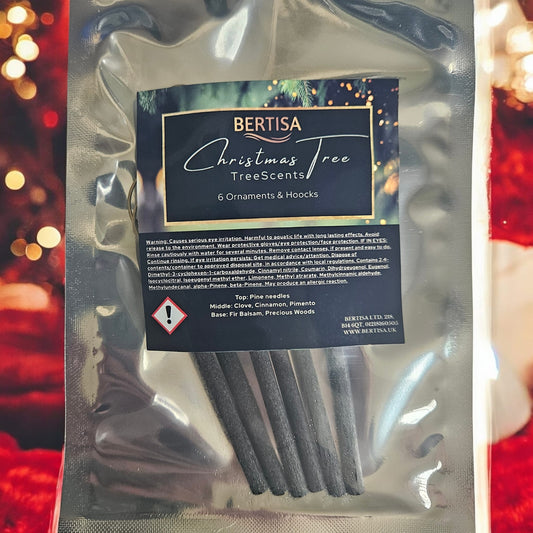 Packaged Christmas tree scents with Bertisa label against a blurred festive background